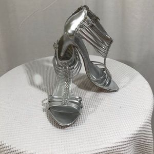 Silver heels with rhinestone embellishments.